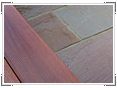 Wet decking and Indian sandstone paving highlights colourings